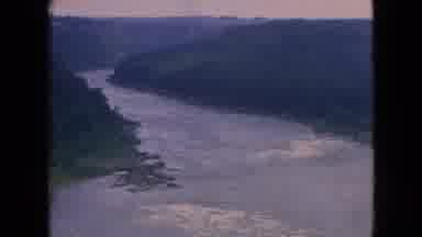 Niagra Falls New York (1964): Aerial Footage Of Large White-Capped River In