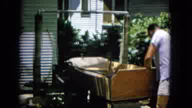 Hawaii (1965): Man Busy Outside Of A House