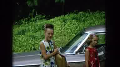 Hawaii (1965): Two Girls In Dresses Smiling And Having Fun Waiting Around A Car