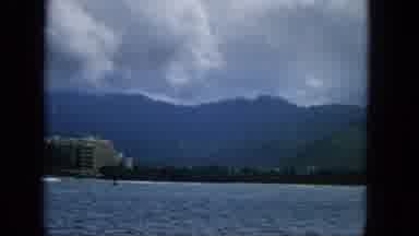 Hawaii (1965): Landscape Of Green Mountains, Fluffy White Clouds, And Blue Water