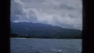 1965:EASTER MOLOKAI WHALES BEACH PARADE ALOHA TOWER. City Skyline Seem Over