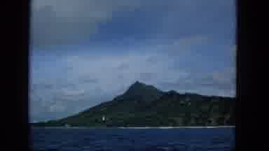 1965: Hawaiian Island Mountain View From Boat With Film Grain