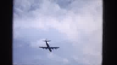 1965:EASTER MOLOKAI WHALES BEACH PARADE ALOHA TOWER. Plane Flying In The Air And