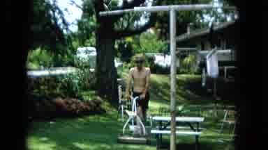 1965:EASTER MOLOKAI WHALES BEACH PARADE ALOHA TOWER. Man In Shorts And Hat Mows