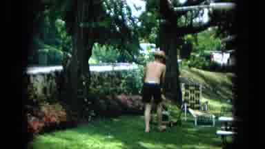 1965:EASTER MOLOKAI WHALES BEACH PARADE ALOHA TOWER. Man In Shorts Mowing Lawn