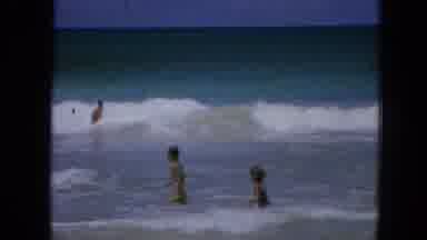 1965:EASTER MOLOKAI WHALES BEACH PARADE ALOHA TOWER. Two Girls At The Beach With