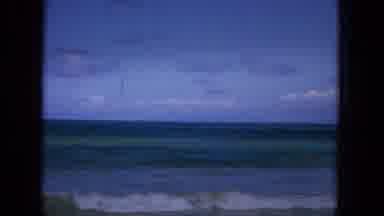 1965:EASTER MOLOKAI WHALES BEACH PARADE ALOHA TOWER. Surfers Paddle Out To Sea