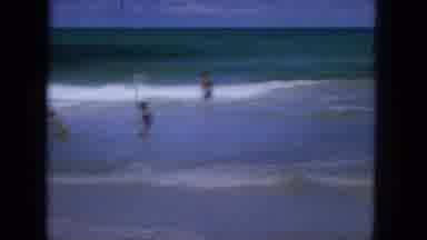 1965:EASTER MOLOKAI WHALES BEACH PARADE ALOHA TOWER. Surfers Paddle Out To Sea