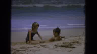 1965:EASTER MOLOKAI WHALES BEACH PARADE ALOHA TOWER. Two Girls Playing In The