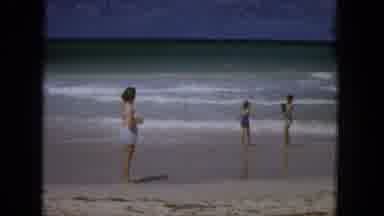 1965:EASTER MOLOKAI WHALES BEACH PARADE ALOHA TOWER. A Woman And Two Children On