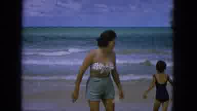 1965:EASTER MOLOKAI WHALES BEACH PARADE ALOHA TOWER. Woman And Child At The