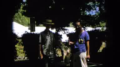 1965:EASTER MOLOKAI WHALES BEACH PARADE ALOHA TOWER. Two Men Holding Up A Kill