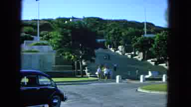 1965:EASTER MOLOKAI WHALES BEACH PARADE ALOHA TOWER. People Walking Down City