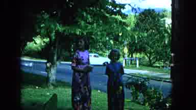 1965:EASTER MOLOKAI WHALES BEACH PARADE ALOHA TOWER. Girls Enjoy A Shady Spot On
