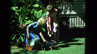 1965:EASTER MOLOKAI WHALES BEACH PARADE ALOHA TOWER. Two Girls Pose In Front Of