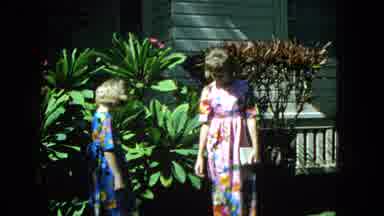 1965:EASTER MOLOKAI WHALES BEACH PARADE ALOHA TOWER. Girls Taking A Picture