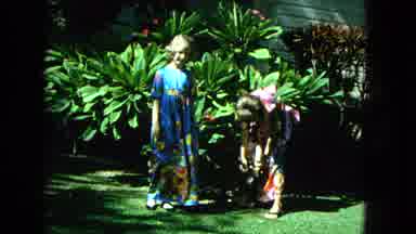 1965:EASTER MOLOKAI WHALES BEACH PARADE ALOHA TOWER. Two Young Ladies, Trying To