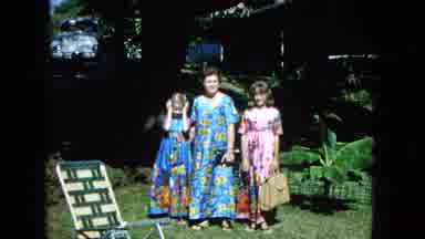 1965:EASTER MOLOKAI WHALES BEACH PARADE ALOHA TOWER. Three Ladies Standing In