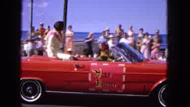 1965:EASTER MOLOKAI WHALES BEACH PARADE ALOHA TOWER. Women On Back Of Red Car