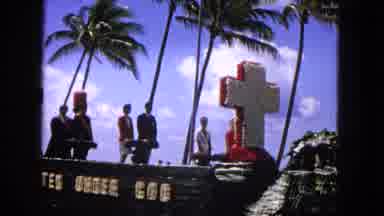 1965: EASTER PARADE ON MOLOKAI HAWAII WITH FLORAL CROSS AND 'UNITED UNDER GOD' FLOAT