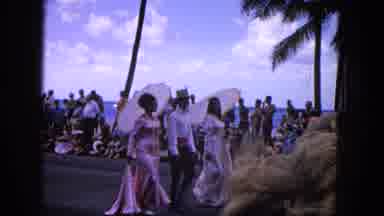 1965: Easter Parade On Molokai Beach With Flowers, Performers, And Crowds