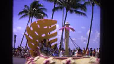 1965: Easter Molokai Whales Beach Parade Aloha Tower. Unique Floral Float Riding Along