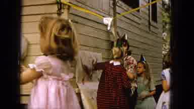 1965:EASTER MOLOKAI WHALES BEACH PARADE ALOHA TOWER. Children Playing At A