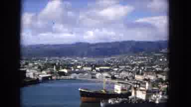 1965:EASTER MOLOKAI WHALES BEACH PARADE ALOHA TOWER. Boats In A City Harbor