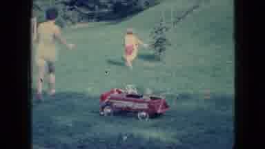 Wellsburg Iowa (1965): Mother And Child Chasing A Duck