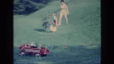 Wellsburg Iowa (1965): Child Chasing A Chicken