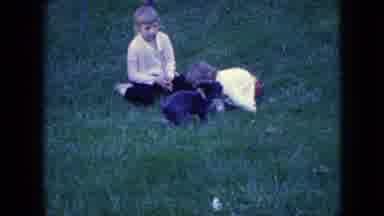 Wellsburg Iowa-1965: Two Young Children Playing In Yard With Puppy