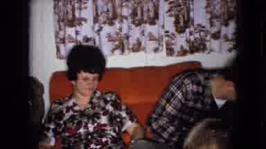 Wellsburg Iowa (1965): Dad Snuggles Mom And Tries To Steal A Kiss On The Sofa