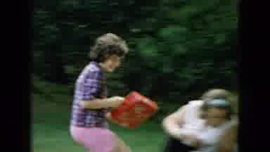 Wellsburg Iowa (1965): Child Running With Gift And Another Child With A Duck