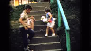Wellsburg Iowa (1965): Three Children Sitting On House Steps At Playtime Playing