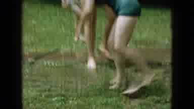 Wellsburg Iowa (1965): Family Playing With Water Hose