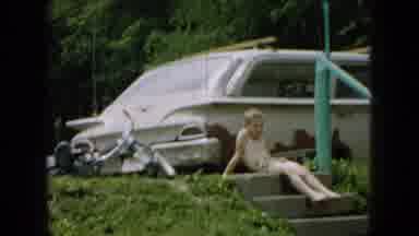 Wellsburg Iowa (1965): Family In Bathing Suits Playing With Water Hose