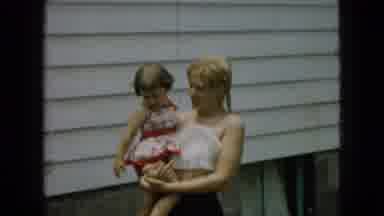 Wellsburg Iowa (1965): Women And Children Playing With Hose Prepare To Spray