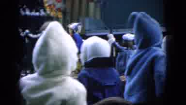 Wellsburg Iowa (1965): People Watching A Marching Band In The City.