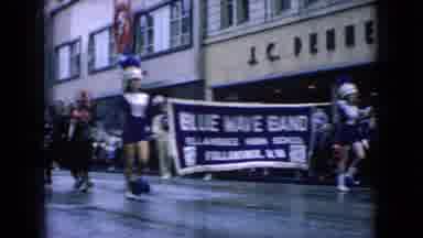 Wellsburg Iowa (1965): Blue Wave Band Marching Through City Streets During Parade