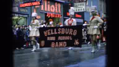 Wellsburg Iowa (1965): Thanksgiving Day Parade Band Marches Down The Wet Streets