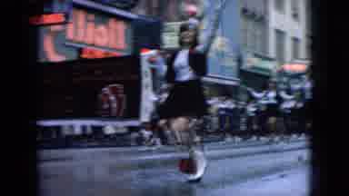 Wellsburg Iowa (1965): People Are Dancing On The Streets Wearing A Costume.
