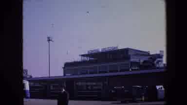 Amsterdam Netherlands (1967): Man Stands In Front Of Amsterdam Structure Awaiting