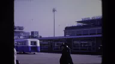 Amsterdam Netherlands (1967): Woman In Black With Luggage Walking On The Street