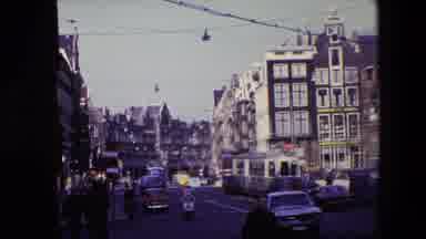 Amsterdam Netherlands (1967): Electric Bus And Other Traffic Moving Past