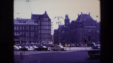 Amsterdam Netherlands (1967): A Busy City Street With Cars Driving By.