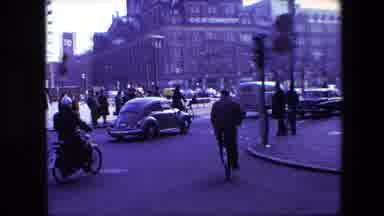 Amsterdam Netherlands (1967): Busy Urban Intersection With Vehicles, People And