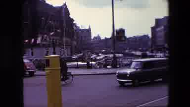Amsterdam Netherlands-1967: Sean Shot Of Activity On A Busy Street Corner In An