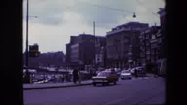 Amsterdam Netherlands (1967): Vehicle Traffic On A Busy City Street During