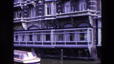 Amsterdam Netherlands (1967): Small.Boat Anchored In Front Of Many-Windowed