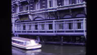 Amsterdam Netherlands (1967): A Boat Parked In Front Of A Restaurant On Water .